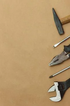 Authentic worn various tools on border with copyspace. flat lay. top view. Stock Photos