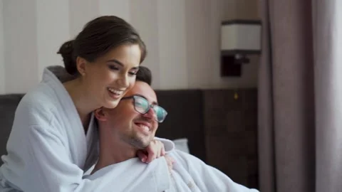 Authentic of young just married couple wearing pajamas having fun. Slow motion Stock Footage 207117554