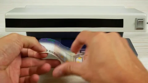 Authentication of money on the detector Stock Footage 79034968