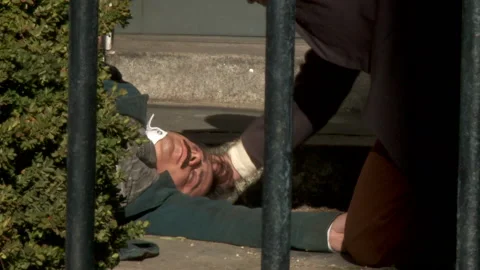 Author Edgar Allen Poe Lying Dead on the street - Actor portrayal Stock Footage 221511637