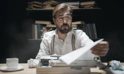Author looking at typescript Stock Photos