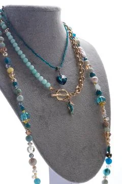 Author set with different blue colors  necklaces  presented on maneken agai.. Stock Photos