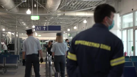Authorities waiting tourists to arrive to get COVID-19 tests at Athens Airport Stock Footage 142858481