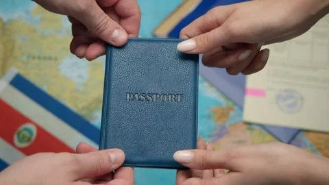 Authority representative offers Costa Rican passport to citizen with Central Stock Footage 331262792