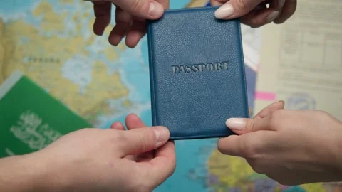 Authority representative offers Saudi passport to citizen beside approved forms Stock Footage 331262750