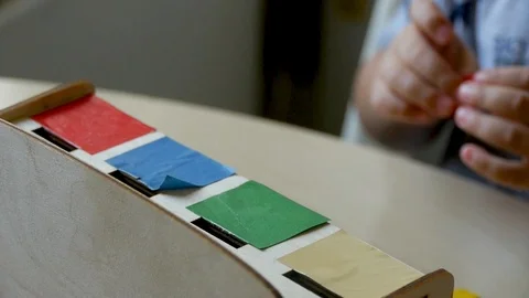 Autistic arranges objects by colors clup1 Stock Footage 114762389