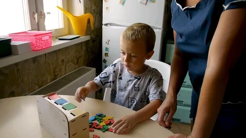 Autistic arranges objects by colors Stock-Footage 114762372