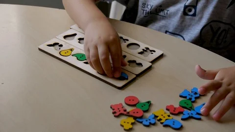 Autistic boy arranges objects in a form 2 스톡 동영상 114762241