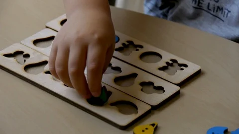 Autistic boy arranges objects in a form clouseup 스톡 동영상 114762383