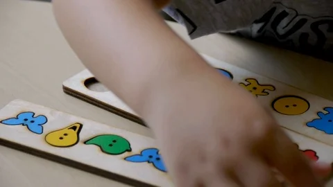 Autistic boy completed a form-folding lesson 스톡 동영상 114761366