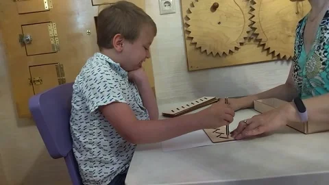 Autistic boy is drawing Stock Footage 221742794