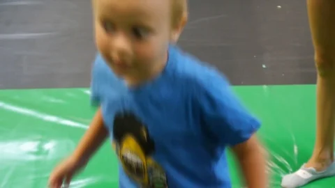 Autistic boy jumps on a trampoline close Stock-Footage 115320106