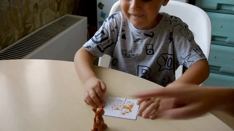 Autistic boy naughty while assembling a puzzle close 스톡 동영상 114745702