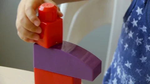 Autistic child collects constructor closeup Stock-Footage 114572661