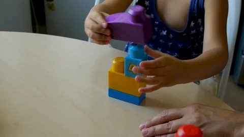 Autistic child collects constructor closeup1 Stock-Footage 114572673
