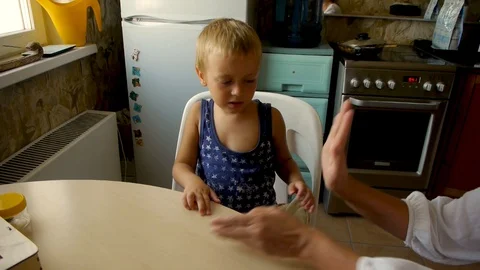 Autistic child gives five Stock Footage 114572815