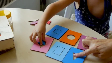 Autistic child puzzles closeup2 스톡 동영상 114572904