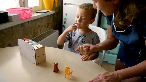 Autistic picks items Stock Footage 114744011