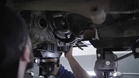 Auto car mechanics work under the car Stock Footage 196151117