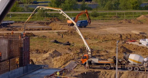 Auto concrete pump takes a mortar in a concrete mixer and pours it into the form Stock Footage 161988307