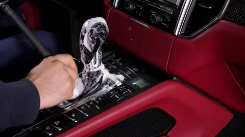 Auto detailing worker cleaning car interior, car detailing concept. Stock Footage 312439986