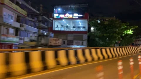 Auto driver crossing a flyover with fuel speed at night Stock Footage 162980288