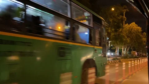 Auto driver overtaking public transport bus at night Video stock 162980212