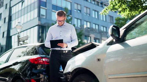 Auto Insurance Adjuster Assessing Car Damage After Accident Stock Footage 314124350