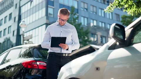 Auto Insurance Adjuster Assessing Car Damage After Accident Stock Footage 314515057