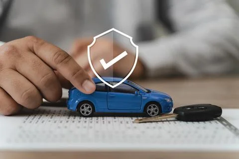 Auto insurance coverage and vehicle protection concept with agent hand pres.. Stock Photos