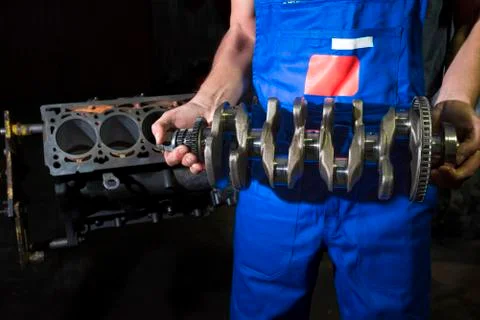 Auto mechanic and car engine part close-up. Repair service. Car service. Stock Photos