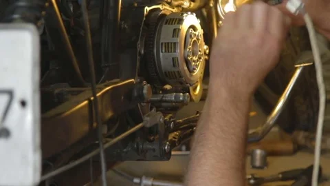 Auto mechanic assembles custom motorcycle in his workshop. Stock Footage 78222894