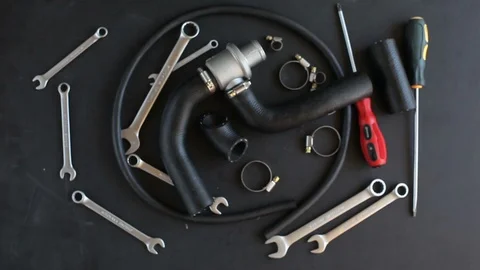 Auto mechanic assembles thermostat Stock Footage 91271059