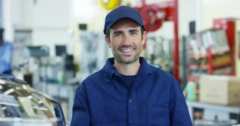 An auto mechanic in a car service, checks the machine diagnostics. Stock Footage