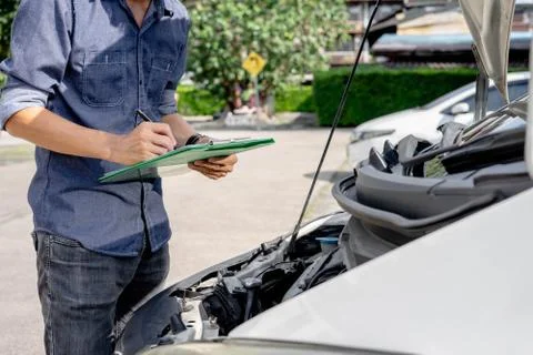 Auto mechanic checking and maintenance car engine. Service and maintenance ca Stock Photos