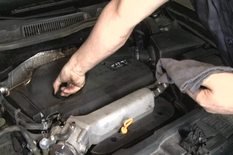 Auto mechanic checking engine oil level Stock Footage 721263