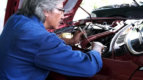 Auto mechanic checking fuse electricity system of car,service and maintenance. Stock Footage 119418747