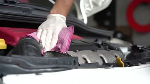 An auto mechanic is cleaning the engine compartment. car service. close-up. Stock Footage 204083791