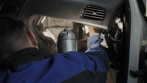 Auto mechanic cleans the interior of the car Stock Footage 194845561