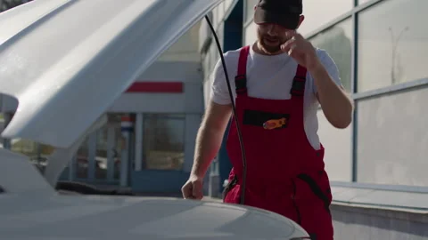 Auto mechanic diligently repairs broken car his expertise evident as auto Stock Footage 270957002