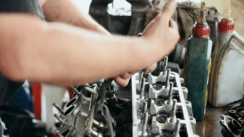 Auto mechanic doing car engine repair work Stock Footage 110805404