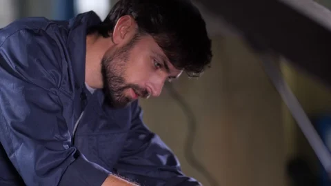 Auto mechanic during replacement of car oil filter Stock Footage 123504254