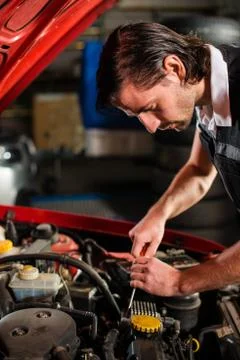 Auto mechanic fixing car engine Stock Photos