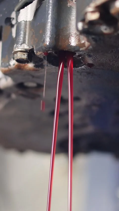 Auto mechanic loosen automatic transmission oil drain plug Stock Footage 316937183