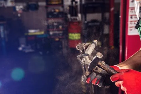 Auto mechanic makes the maintenance. Stock Photos