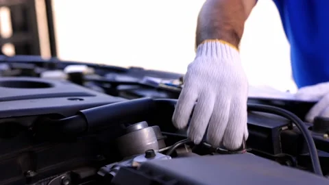 A auto mechanic opens the bonnet. To check for engine damage And perform profess Stock Footage 152747988