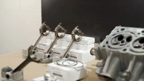 Auto mechanic rebuilds engine with new pistons, rings, liners, demonstrates Stock Footage 260718090