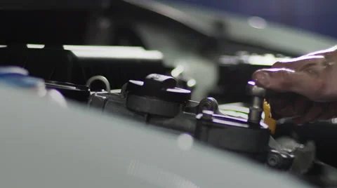 Auto mechanic repair engine at car repair shop. Slow motion Stock Footage 63447659