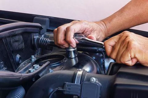 Auto mechanic repair engine close up hand Stock Photos