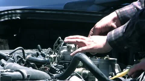 Auto mechanic repairing a car engine Stock Footage 10587359